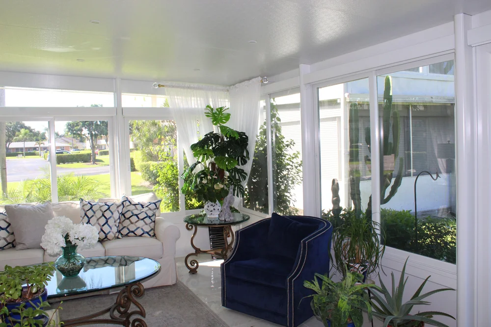 Elite sunroom addition with full-height views